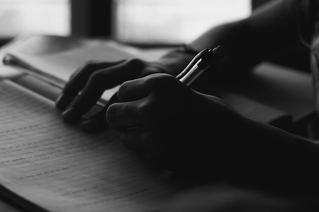 person editing manuscript