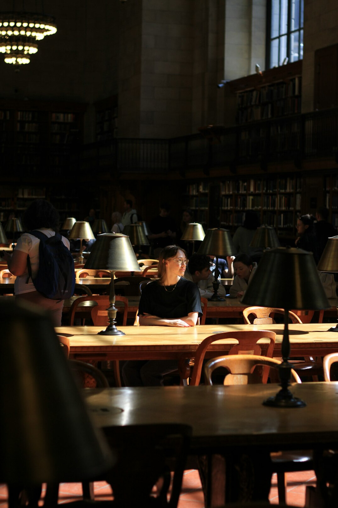 writer at desk with lamp